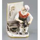 A Rockingham porcelain figure of a seated cobbler, c.1830, the figure whistling to a bird in a cage,