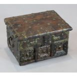 A small 17th century Spanish or Portuguese brass mounted walnut chest, with rising lid and three