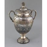 A George IV silver two handled presentation pedestal trophy cup and cover by Benjamin Smith III,