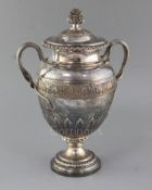 A George IV silver two handled presentation pedestal trophy cup and cover by Benjamin Smith III,