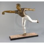 A French Art Deco patinated spelter figure of a boules player, on two colour marble plinth, height