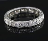 A platinum? and diamond set full eternity ring, with engraved shank and set with twenty eight