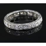 A platinum? and diamond set full eternity ring, with engraved shank and set with twenty eight