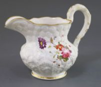 A Rockingham porcelain water jug, c.1830, moulded with flowers and leaves, each side painted with