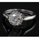 A platinum and solitaire diamond ring, the round cut stone weighing approximately 1.00ct, size K.