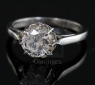 A platinum and solitaire diamond ring, the round cut stone weighing approximately 1.00ct, size K.