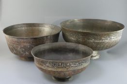 An 18th/19th century Persian tinned copper bowl, with inscribed and foliate decorated bands,