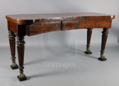 A Regency mahogany concave serving table, with three frieze drawers and brass mounted, turned and