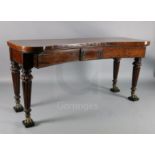 A Regency mahogany concave serving table, with three frieze drawers and brass mounted, turned and