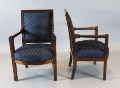 A pair of 19th century French Empire style fauteuils, with floral carved arm terminals, W. 2ft. H.