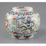 A Chinese wucai 'dragon' jar, Qing dynasty, painted four reserves of confronting dragons, within