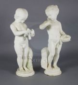 A pair of 19th century Italian carved white marble figures of putti, one holding a bird's nest,