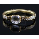 A George II gold, white enamel and rock crystal set mourning ring, with hair beneath the central