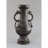 A Chinese bronze temple vase, Song-Yuan dynasty (12th-14th century), of flattened baluster shape