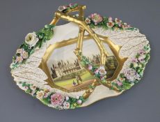 A large Rockingham porcelain elongated octagonal basket, c.1830-42, finely painted with a titled