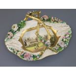 A large Rockingham porcelain elongated octagonal basket, c.1830-42, finely painted with a titled