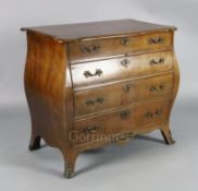 A 19th century Dutch ormolu mounted mahogany bombe commode, with serpentine top, fitted four