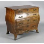 A 19th century Dutch ormolu mounted mahogany bombe commode, with serpentine top, fitted four