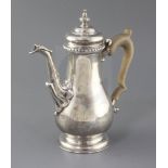 A modern George II style coffee pot by Rodney C. Pettit, of baluster form, with leaf capped spout