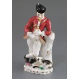 A Rockingham porcelain figure of a piping shepherd, c.1826-30, leaning against a tree stump with a