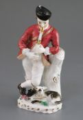 A Rockingham porcelain figure of a piping shepherd, c.1826-30, leaning against a tree stump with a