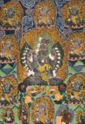 A thangka depicting a Buddhist wrathful deity, Tibet, first half 20th century, surrounded other