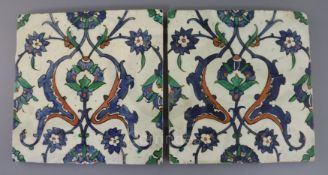 A pair 17th century Ottoman polychrome glazed fritware tiles, decorated in red, blue and green