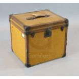 A 1920's Louis Vuitton small travelling trunk, with tan orange leather bound by brass studded