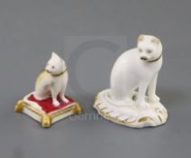 Two Rockingham porcelain toy figures of cats, c.1830, the first gilt and white, on a rococo base,