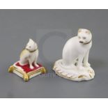 Two Rockingham porcelain toy figures of cats, c.1830, the first gilt and white, on a rococo base,