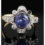 An early-mid 20th century 18k gold, sapphire and diamond cluster ring, of quatrefoil shape, the