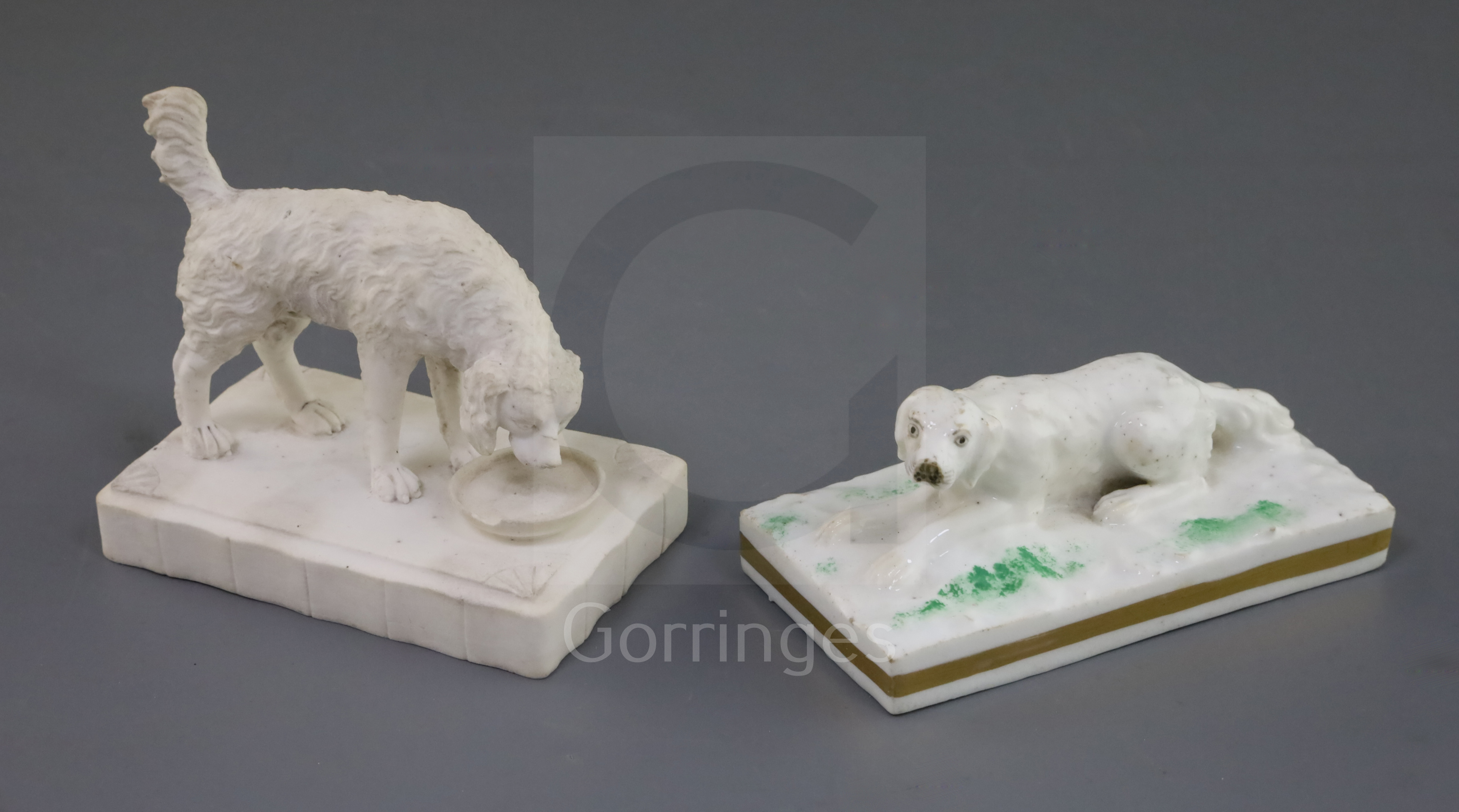 Two Rockingham porcelain figures of a setters, c.1830, the first recumbent on a rectangular base