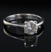 A modern 18ct white gold and solitaire diamond ring, the round brilliant cut stone measuring