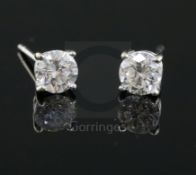 A pair of 18ct white gold and solitaire diamond ear studs, each stone with a diameter of