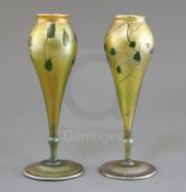 A pair of Tiffany gold favrile glass vases, c.1915, of tulip form, each decorated with a green