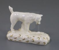 A Rockingham porcelain figure of a terrier observing a rat, c.1830, highlighted in gilt, unnumbered,