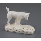 A Rockingham porcelain figure of a terrier observing a rat, c.1830, highlighted in gilt, unnumbered,