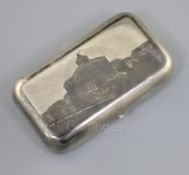 A 19th century Russian 84 zolotnik silver and niello cigarette case, decorated with a view of