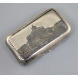 A 19th century Russian 84 zolotnik silver and niello cigarette case, decorated with a view of