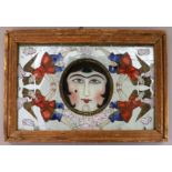 A 19th century Qajar painted and reverse painted mirror, with central face motif flanked by four