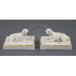 A pair of Rockingham porcelain figures of pointers, c.1830, each recumbent on a fluted rectangular