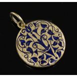 A Victorian gold and blue enamel mourning pendant locket, with scrolling arabesque decoration and