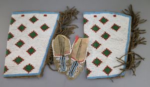 A pair of 19th century Native American Northern Plains beadwork skin child's moccasins, 5in. and a