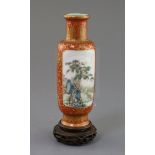 A Chinese coral ground famille rose cylindrical vase, Qianlong mark, Republic period, finely painted