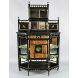 A Victorian Aesthetic Movement parcel gilt, ebonised and burr wood chiffonier, with raised