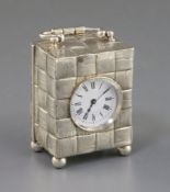 A late Victorian silver cased carriage timepiece, with textured basket weave decoration, maker, G.B,