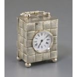 A late Victorian silver cased carriage timepiece, with textured basket weave decoration, maker, G.B,