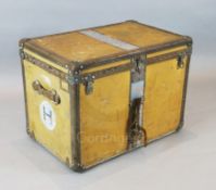 A 1920's Louis Vuitton travelling trunk, upholstered in orange tan canvas, original canvas lined