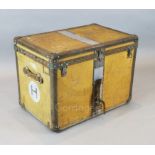 A 1920's Louis Vuitton travelling trunk, upholstered in orange tan canvas, original canvas lined