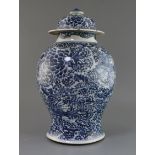 A large Chinese blue and white vase and cover, Kangxi period, painted with phoenix amongst flowering